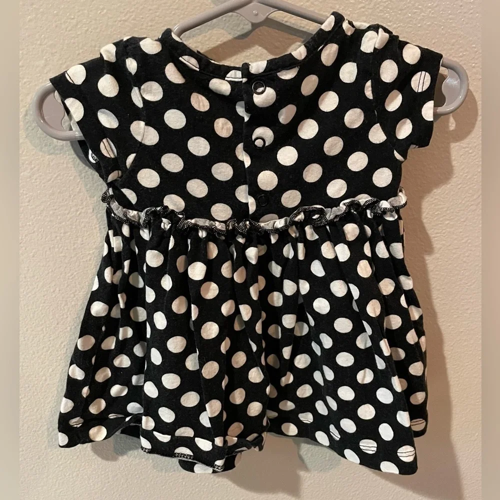 Carter’s Navy and white polka dot dress with pink butterfly and bow details.